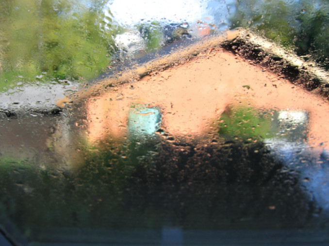 Heavy rain with house in distance: SBDPro Small Business Blog