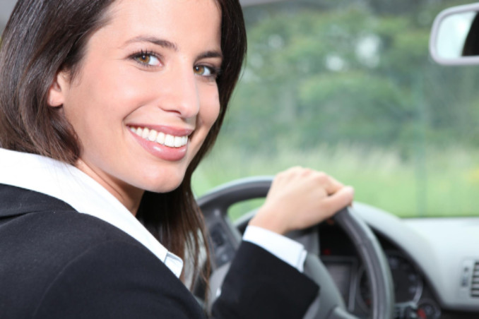 Woman in suit driving car: SBDPro Automotive Blog