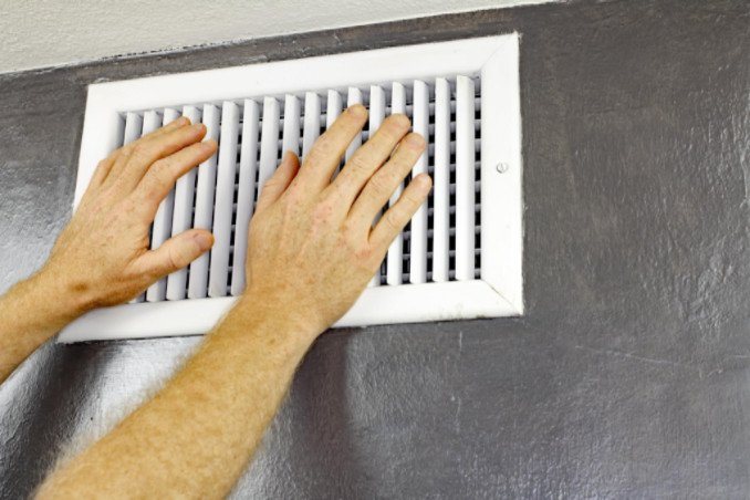 man closing a vent