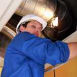 Man fixing heating system: SBDPro Small Business Blog